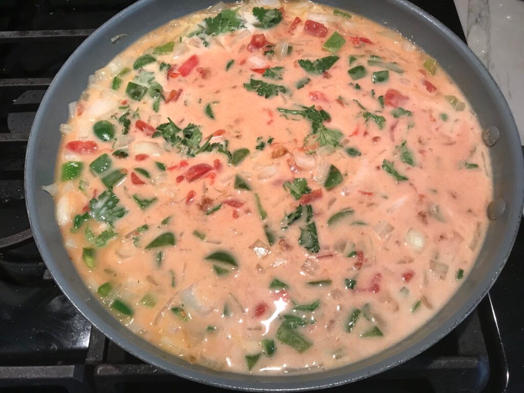 All ingredients except for shrimp mixed together in a skillet for Coconut Shrimp Stew Recipe.