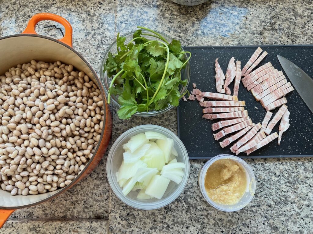 Ingredients chopped, diced, and measured out into bowls for Carioca Beans recipe.