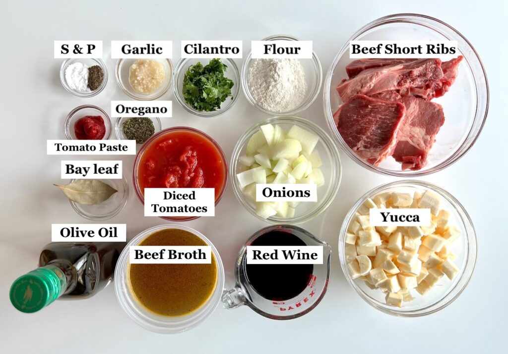 Ingredients prepped and measured out in small bowls for Brazilian Vaca Atolada Beef Rib Stew with yucca, onions, garlic, tomatoes, cilantro in a delicious thick beef wine sauce.