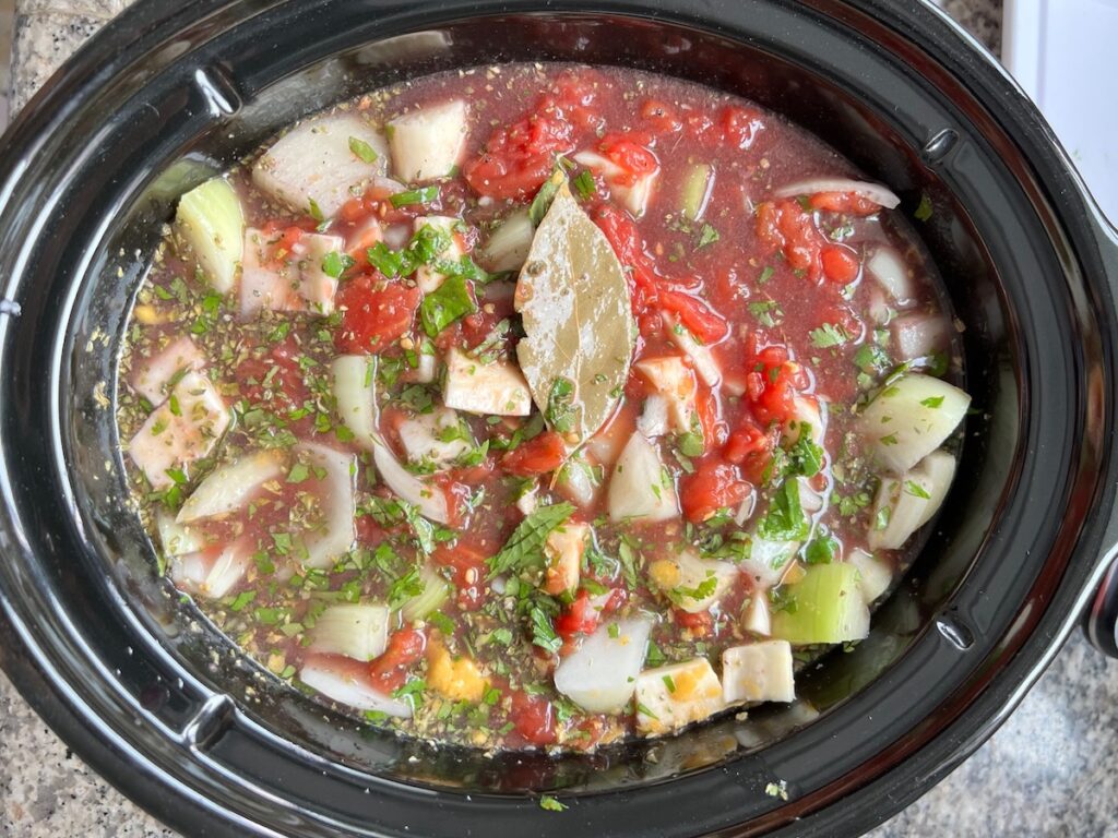 All ingredients in slow cooker pot for Brazilian Vaca Atolada Beef Rib Stew.