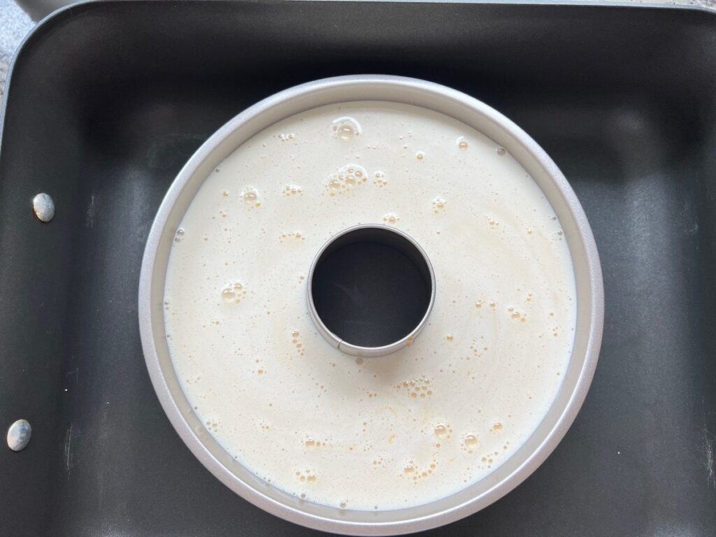 Custard poured into tube pan for Brazilian Flan recipe.