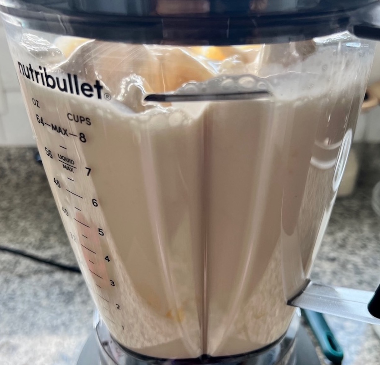 Custard ingredients blending in a blender for Brazilian Flan recipe, or Pudim.