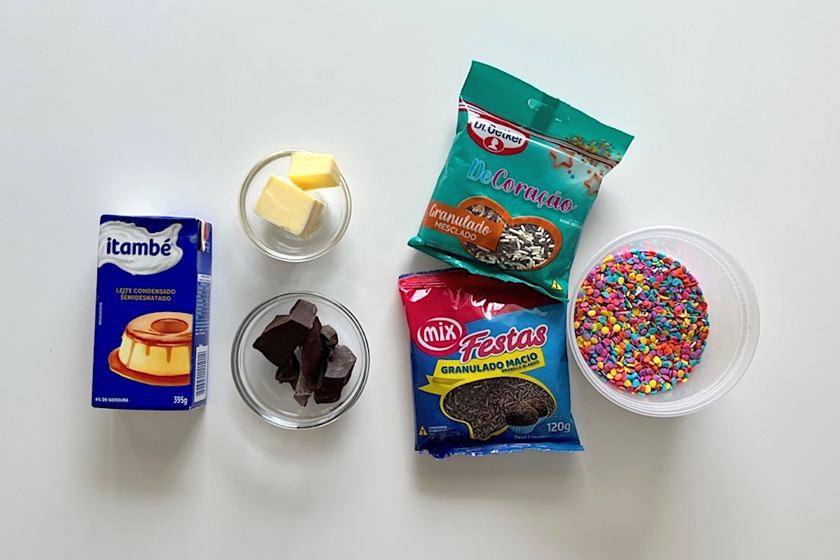 Ingredients on table for Brazilian Cake Brigadeiro topping...sweetened condensed milk, butter, chocolate, and sprinkles.