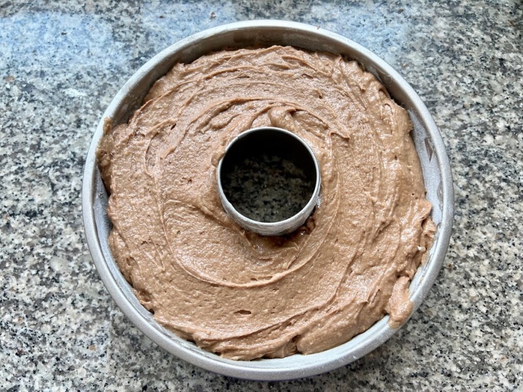Finished cake batter in a tube mold cake pan for Brigadeiro Brazilian Cake.
