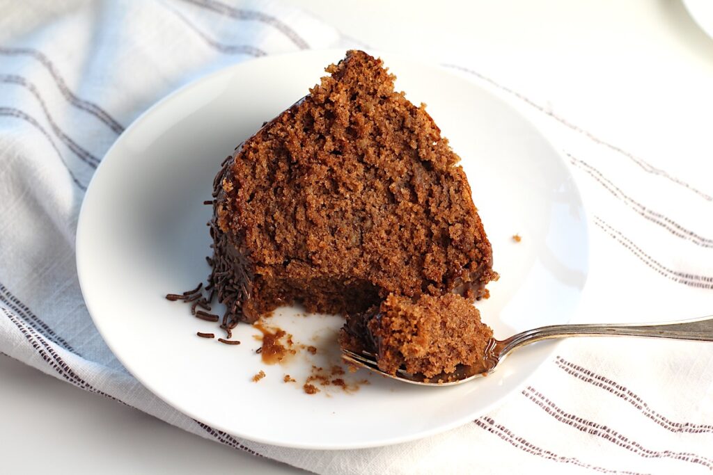 Brigadeiro Brazilian Cake slice on a plate with a fork holding a bite.
