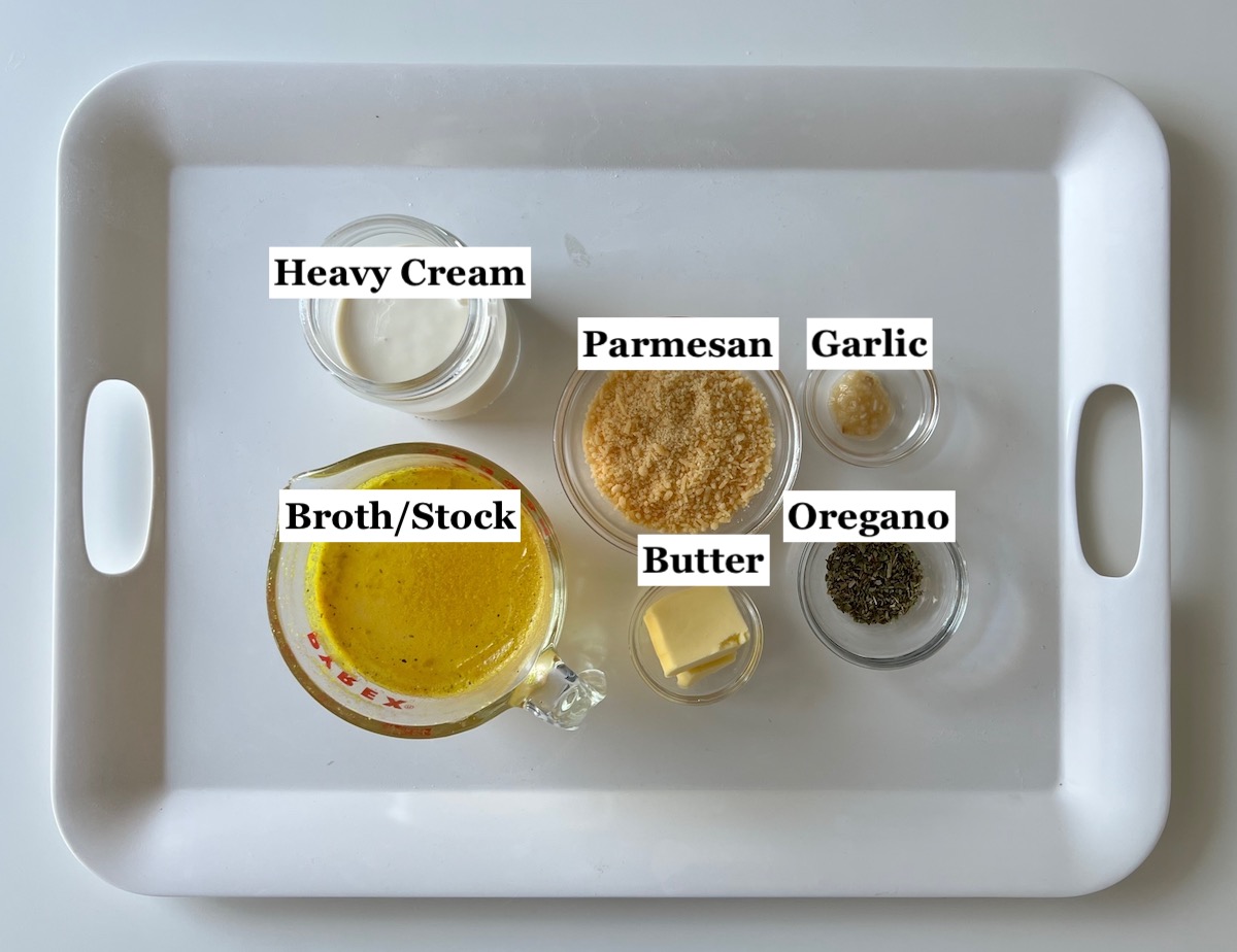 Ingredients prepped and measured out in bowls for the Parmesan cream sauce in this Spicy Sausage Pasta recipe.