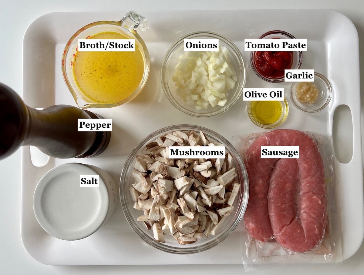 Ingredients prepped and measured out in bowls for the sausage and mushroom ragu in the Spicy Sausage Pasta recipe.