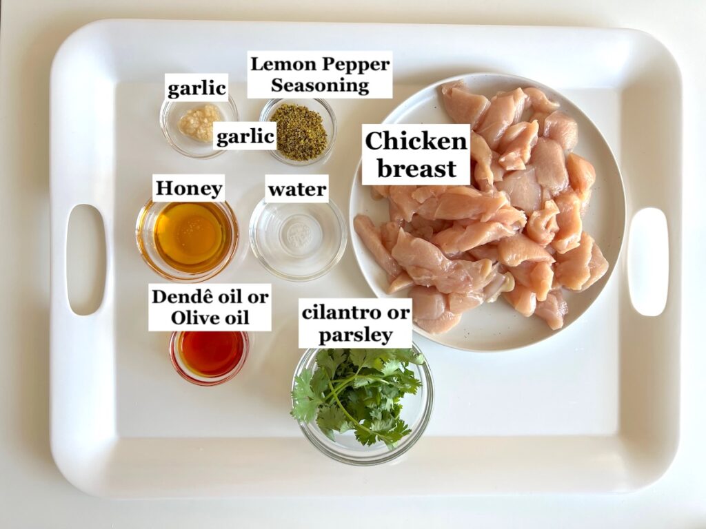 Ingredients prepped and measured out in bowls with labels for the Honey Lemon Pepper Chicken recipe.