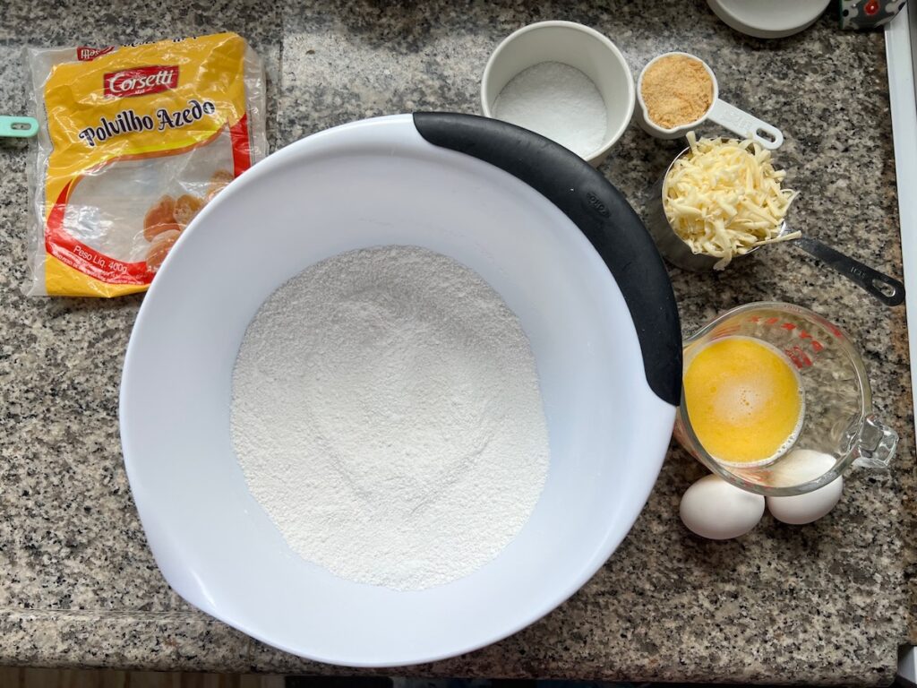 Ingredients prepped and measured out in bowls for Gluten Free Brazilian Cheese Bread.