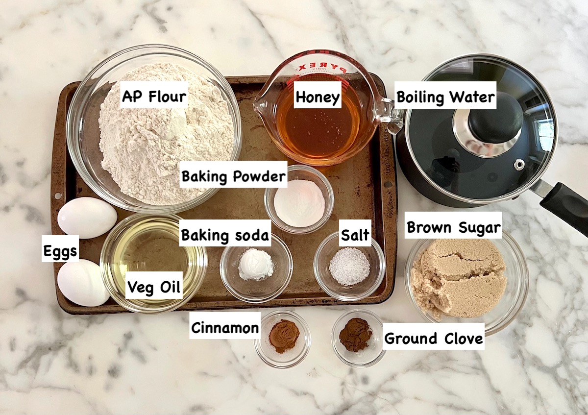 All ingredients measure out in bowls on counter and labeled for this Honey Loaf recipe.